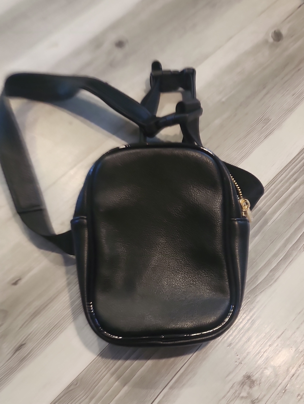 Sleek Black Leatherette Crossbody Bag with Gold Hardware